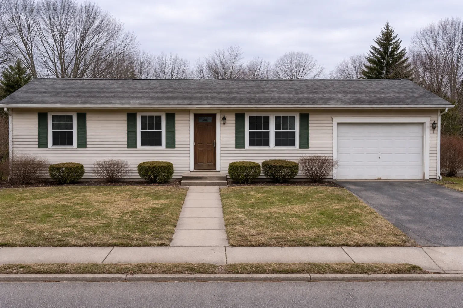 Outdated ranch home exterior with worn lawn and minimal landscaping in Michigan