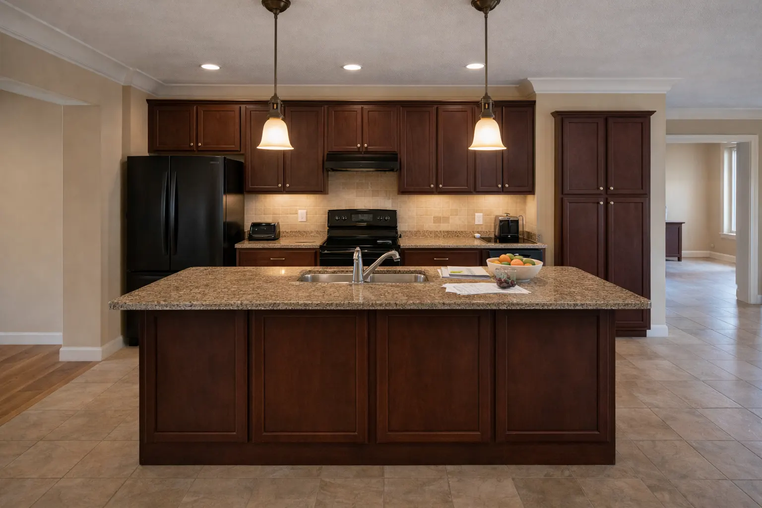 Traditional kitchen with dark cabinets and center island