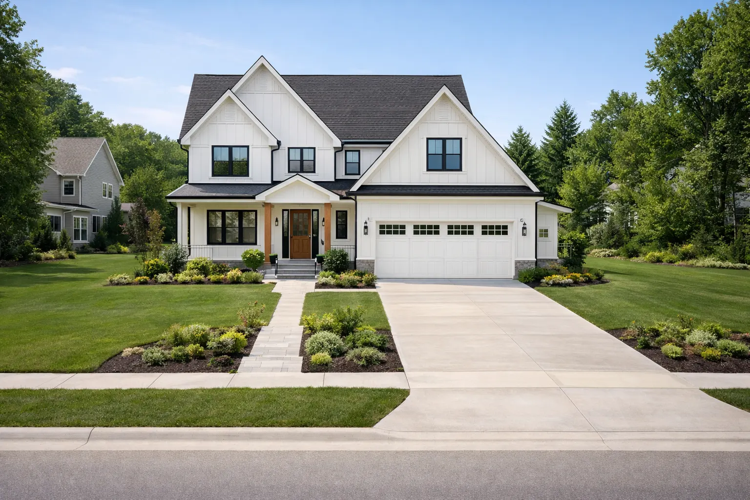 Newly built ranch-style home with finished landscaping and driveway