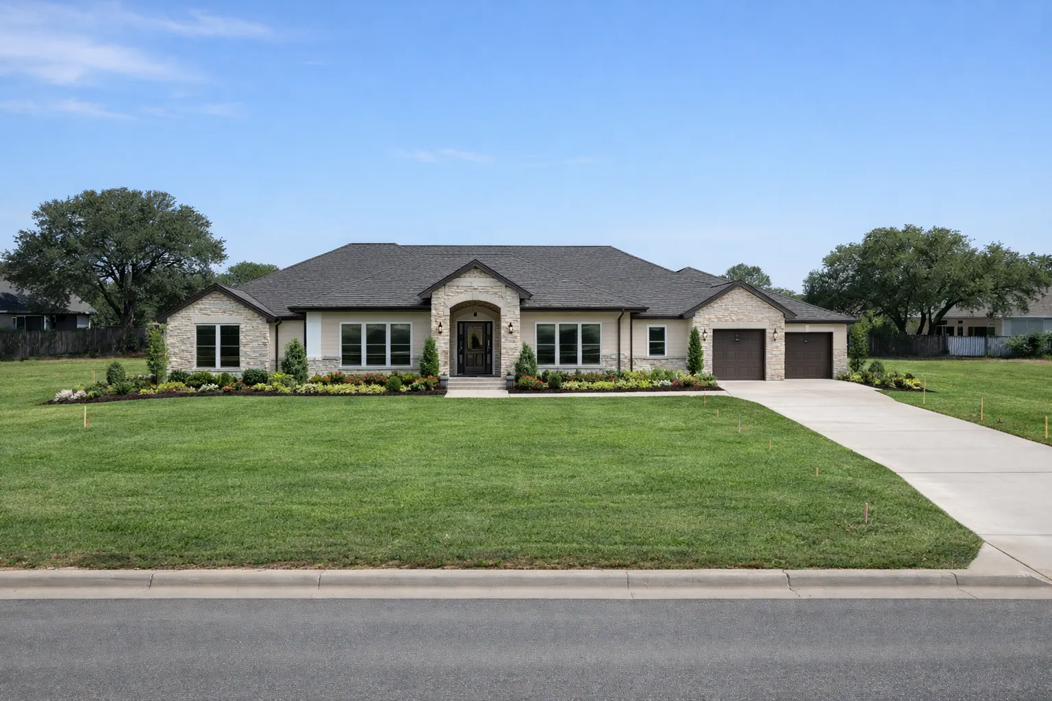 Custom ranch home with stone exterior and landscaped front yard