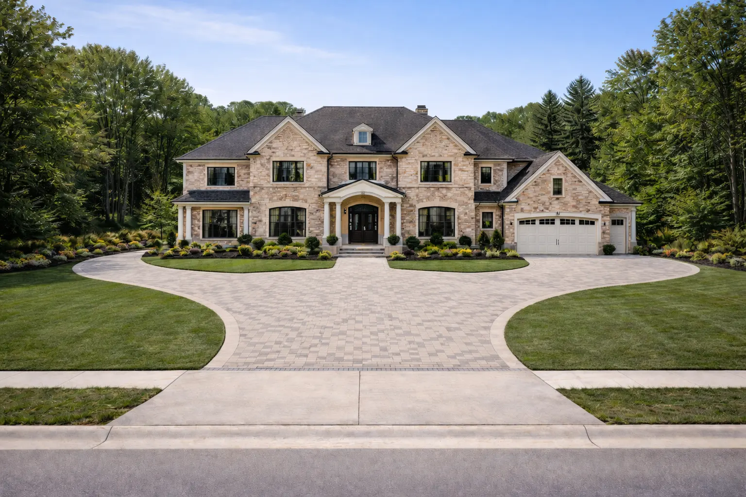Luxury custom two-story stone home with circular driveway and landscaping